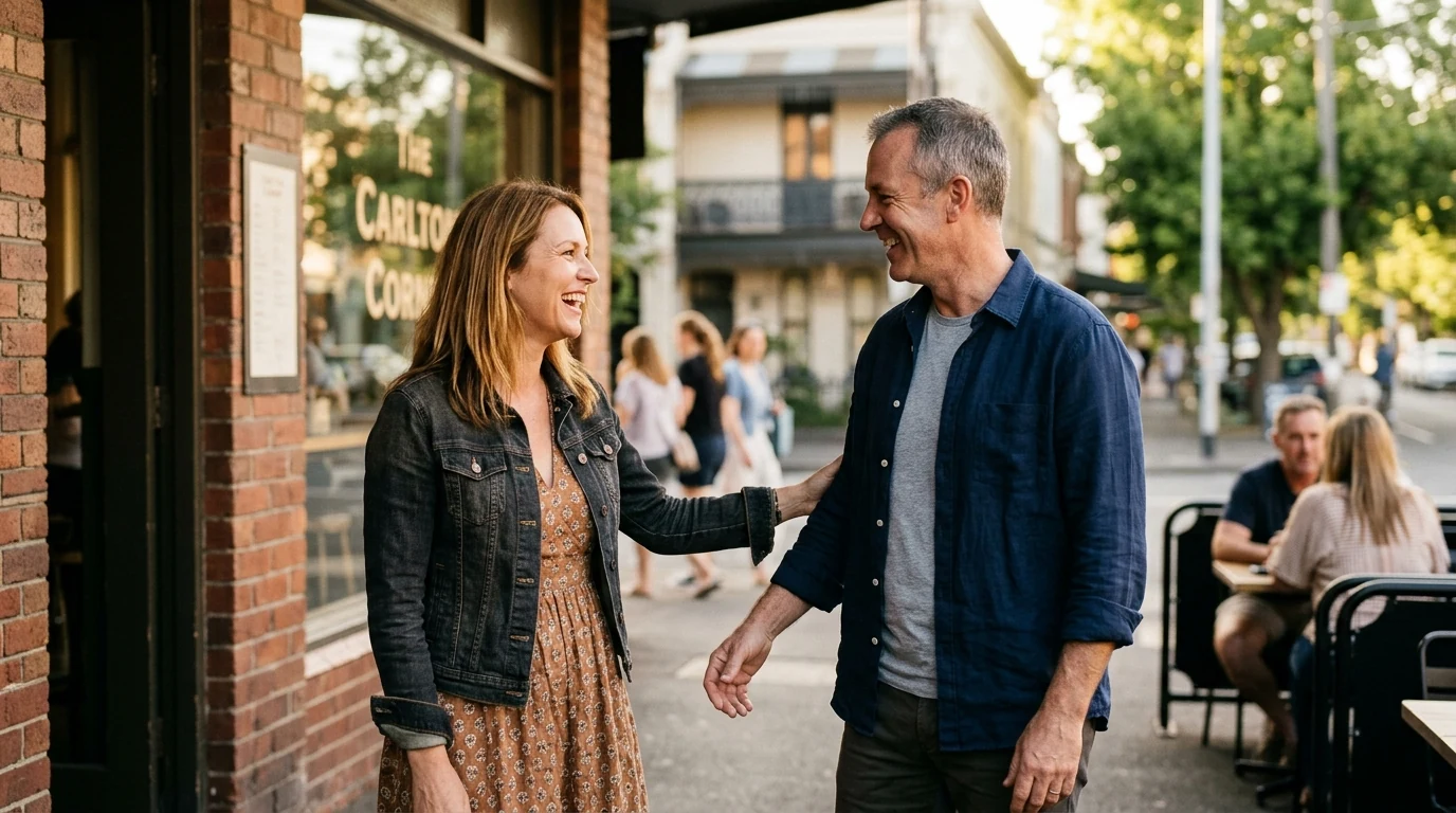 Two people meeting for the first time at a corner cafe in Carlton in Melbourne in the afternoon